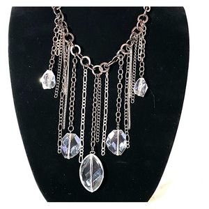 Bib style fashion necklace in gunmetal color.